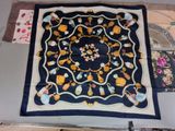 a blue and yellow scarf with a design on it