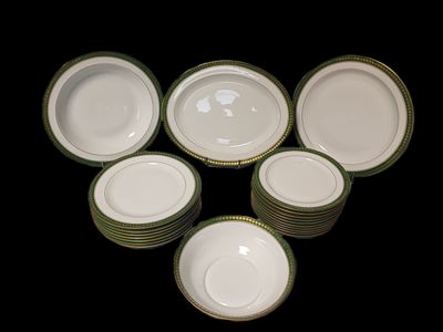 many plates that are sitting on a black table