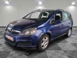 a picture of a blue van parked on a checkered floor