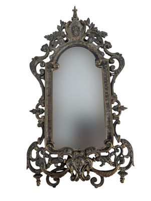 an image of a mirror with a decorative design on it