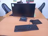 an image of a computer desk with a keyboard and monitor