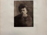 an old black and white photo of a woman with curly hair