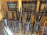 a lot of chairs and tables in a room