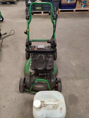 an image of a lawn mower in a warehouse
