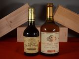 two bottles of wine sitting next to each other on a table
