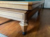 a pool table with a green cloth on top of it