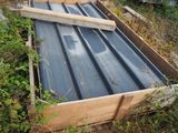a metal roof that is laying on the ground