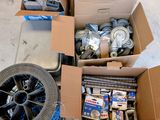 many boxes of assorted items sitting on the floor
