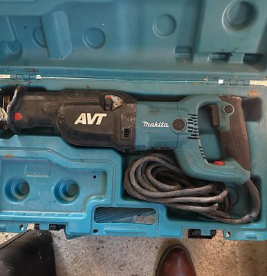 a blue box with a corded hammer and a corded hammer in it
