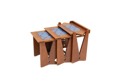 three wooden nesting tables with blue tiles on them
