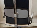 an image of a black and white office chair in a room