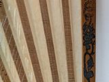 a close up of an old fan on a wall
