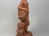 an image of a statue of a woman holding a pot