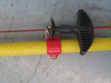 a pipe clamp attached to the side of a yellow pipe
