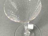 a wine glass sitting on top of a table
