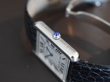 a close up of a wrist watch with a diamond on it