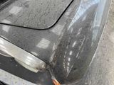 a close up of a car ' s hood with a rusted paint job
