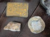 some rocks and other items on a wooden table