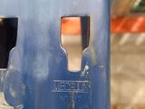 a close up of a piece of metal with holes in it