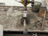 pipes and gauges are sitting on a table in a room