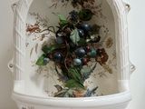a white bowl with a bunch of berries in it