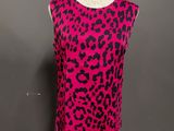 a pink and black leopard print top on a mannequin mannequin