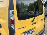 a yellow van that is parked in a parking lot