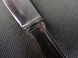 a knife that is laying on top of a table
