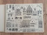 a book with a drawing of a town on it