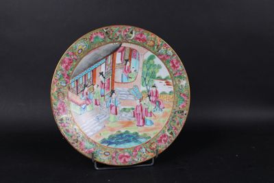 an image of a plate with a painting on it on a black surface