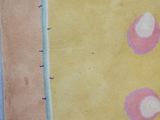 a painting of a yellow and pink flower on a yellow background
