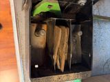 a metal box with a bunch of items inside of it
