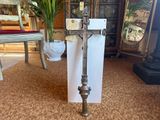 a metal pole with a cross on it in a living room