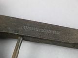 a close up of a pair of scissors on a white surface