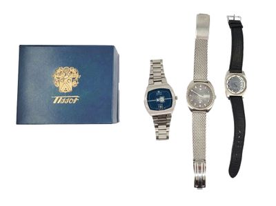 two watches and a watch box sitting next to each other on a white surface
