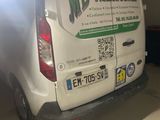 a van that is parked in a garage with its door open
