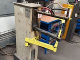 an image of a machine that is working on a piece of metal