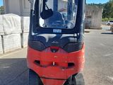 a forklift that is parked in the parking lot