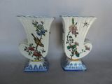 two vases sitting side by side on a table