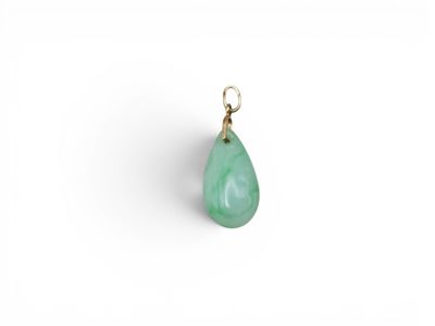 a green jade tear shaped pendant with a gold plated bail