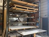 a room with a lot of shelves and tables in it