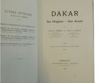 an open book with a black and white image of the title of dakar