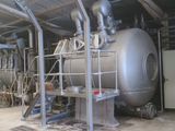 a large metal tank sitting inside of a building
