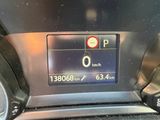 the dashboard of a car with a digital display on it