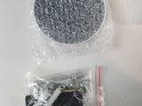a plastic container filled with metal rings and screws on a table