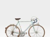 a bike that is sitting on a white surface