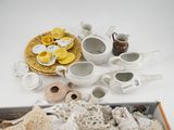 a box full of white and yellow items on a table