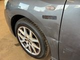 a close up of a car ' s side door with a sticker on it