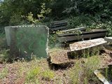 many benches that are sitting in the grass