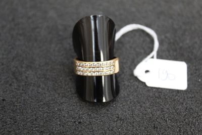 a ring that is sitting on a table next to a price tag
